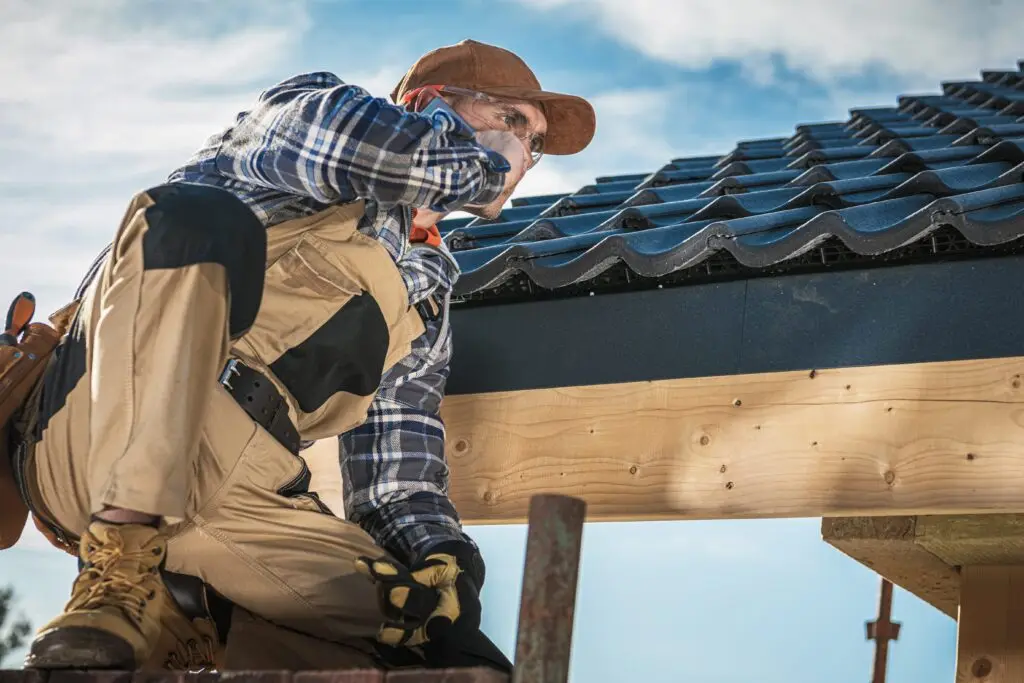 Roofing contractor talking on a cell phone